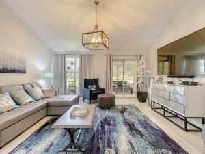 a living room with a couch and a table at Waterfront 3Bed in The Villages in The Villages