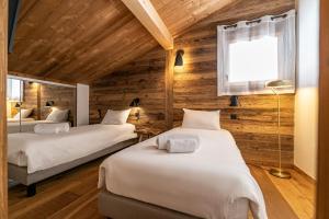 Posteľ alebo postele v izbe v ubytovaní Duplex Pen Men - LES GETS, proche du centre, jacuzzi, superbe vue