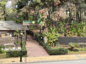 a sign for a park with benches and trees at Elviria Marbella Pinogolf in Marbella