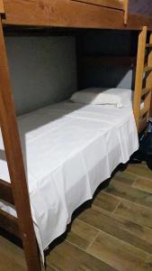 Ein Bett oder Betten in einem Zimmer der Unterkunft Tikira Quarto - Atins