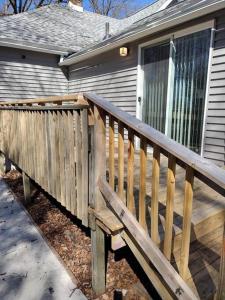 a wooden deck in front of a house at Modern home on city's westside in Bay City