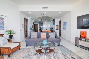 a living room with a couch and a table at Esmeralda Beach Resort in Puerto Pe&ntilde;asco