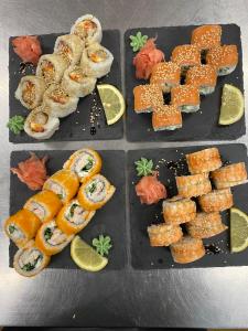 a tray of food with sushi and other foods at Hostel Nele in Jõhvi