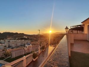 a view of the sunset from a balcony of a building at Espectaculares vistas con todo confort - by Aloha Palma in Águilas