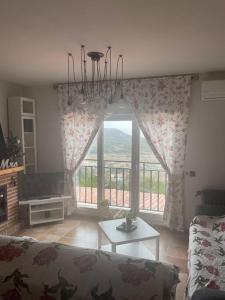 Posedenie v ubytovaní Casa rural con piscina y vistas
