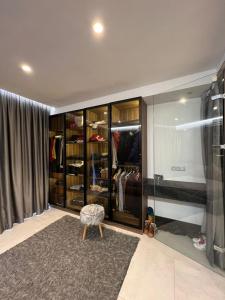 a room with a walk in closet with a chair at Luxury apartment in Casablanca in Casablanca