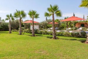 Κήπος έξω από το Somptueuse Villa louée avec le personnel de maison