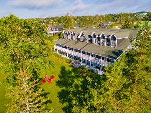 an overhead view of a large house with a yard at Inverary Resort in Baddeck