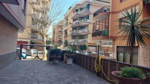 a sidewalk in front of a building with plants at Appartamento da Miriam in Lido di Ostia