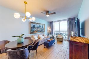 a living room with a couch and a table at Majestic Beach Resort Tower 2- 1805 in Panama City Beach