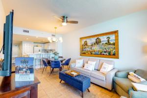 a living room with a couch and a table at Majestic Beach Resort Tower 2- 1805 in Panama City Beach