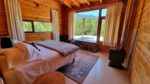 Ліжко або ліжка в номері Peuma Lodge Patagonia