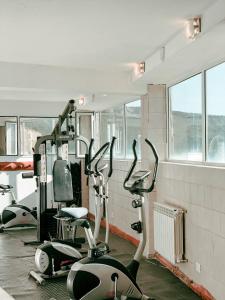 a gym with several exercise bikes in a room at Hotel Spa Nieves Del Cerro in Caviahue