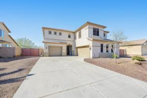 a large white house with a driveway at Rancho Relaxo in Avondale
