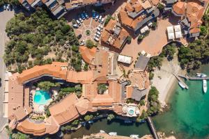 an aerial view of a house with a swimming pool at Cervo Hotel,Costa Smeralda Resort in Porto Cervo