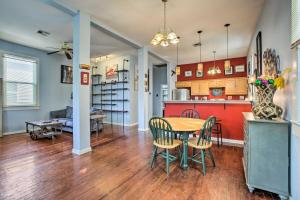 a kitchen and living room with a table and chairs at Charming NOLA Home 5 Miles to Bourbon Street! in New Orleans