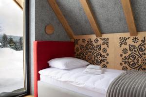 Tempat tidur dalam kamar di Leśny Wierch