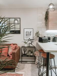 a living room with a table and a counter at Stylish 1Bed Apartment in Sheffield CC in Sheffield +5 photos