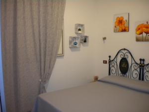 A bed or beds in a room at Villa Nespole e Vermentino