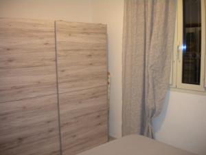 A bed or beds in a room at Villa Nespole e Vermentino