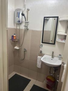a bathroom with a shower and a sink at Ness Haven Camella northpoint condominium in Davao City