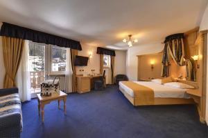 Postel nebo postele na pokoji v ubytování Hotel La Perla