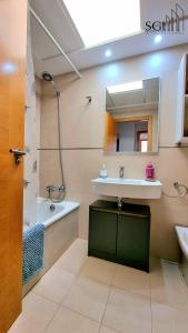 a bathroom with a sink and a mirror at SUNSET Chill Out- Torres D' Oboe in Benidorm +24 photos