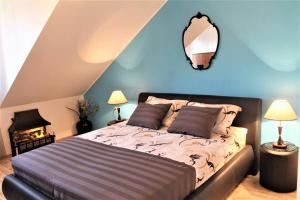 a bedroom with a bed and a mirror on the wall at Apartment Barbara's Inheritance in Split