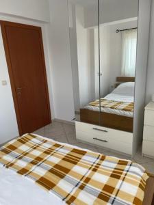 Postel nebo postele na pokoji v ubytování Dina Apartment