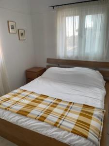 Postel nebo postele na pokoji v ubytování Dina Apartment