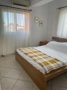 Postel nebo postele na pokoji v ubytování Dina Apartment