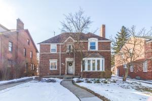 a brick house with snow in front of it at The Parkside / University District/15m to Downtown in Detroit