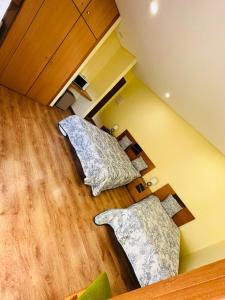 an attic room with two pillows on the floor at Residência Iris in Geres