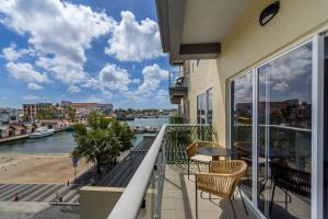 a balcony with a view of a river at Because Location Really Is Everything! in Oranjestad