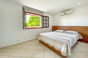 Ένα ή περισσότερα κρεβάτια σε δωμάτιο στο Incrivel casa c piscina em Parque Nanci-Marica RJ +22 φωτογραφίες