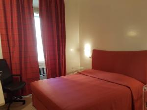 A bed or beds in a room at Popolo square deluxe flat