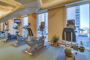 a gym with treadmills and cardio equipment in a building at Majestic Beach Resort Tower 2- 1903 in Panama City Beach