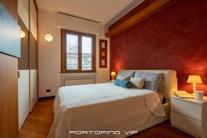 Giường trong phòng chung tại Angolo di Luca by PortofinoVip