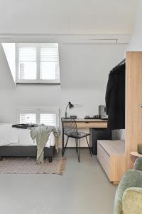 TV a/nebo společenská místnost v ubytování B&B Vossebergen Hombeek