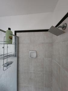a shower with a glass door in a bathroom at 2a - 64 No load shedding 2bed 2bath with garden in Centurion