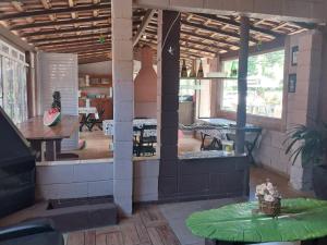 a large room with a table and a room with a table sidx sidx at Pousada Beija flor in Extrema