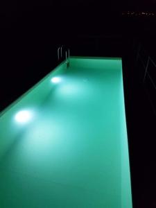 a green table with lights on top of it at quinta vale da corga in Murça