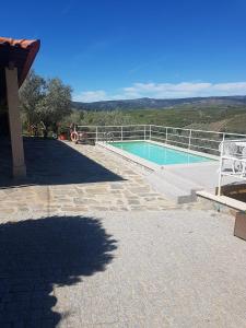 a swimming pool with a fence at quinta vale da corga in Murça