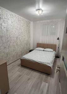 Un pat sau paturi într-o cameră la Modern & Elegant Luxury Apartament