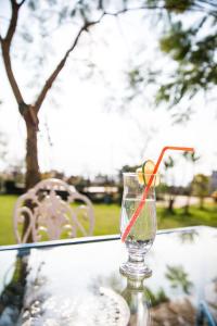 a glass vase sitting on top of a glass table at Vanilla Twilight in Wujie
