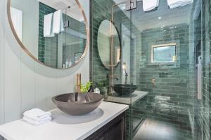 a bathroom with a bowl sink and a shower at Stagford Retreat Apartment - Taupo in Taupo