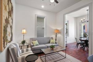 a living room with a couch and a table at La Belle Veranda Villa- 3QueenBeds/2Baths Sleeps 6-8 in New Orleans
