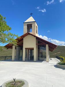 a church with a cross on top of it at Sr.Flat Monte Castelo in Bezerros