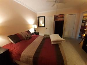 a bedroom with a large bed in a room at Gorgeous Lakeview Front Lake Osborne in Lake Worth