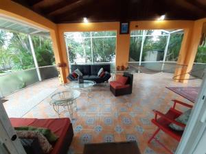 a living room with a couch and a table at Gorgeous Lakeview Front Lake Osborne in Lake Worth